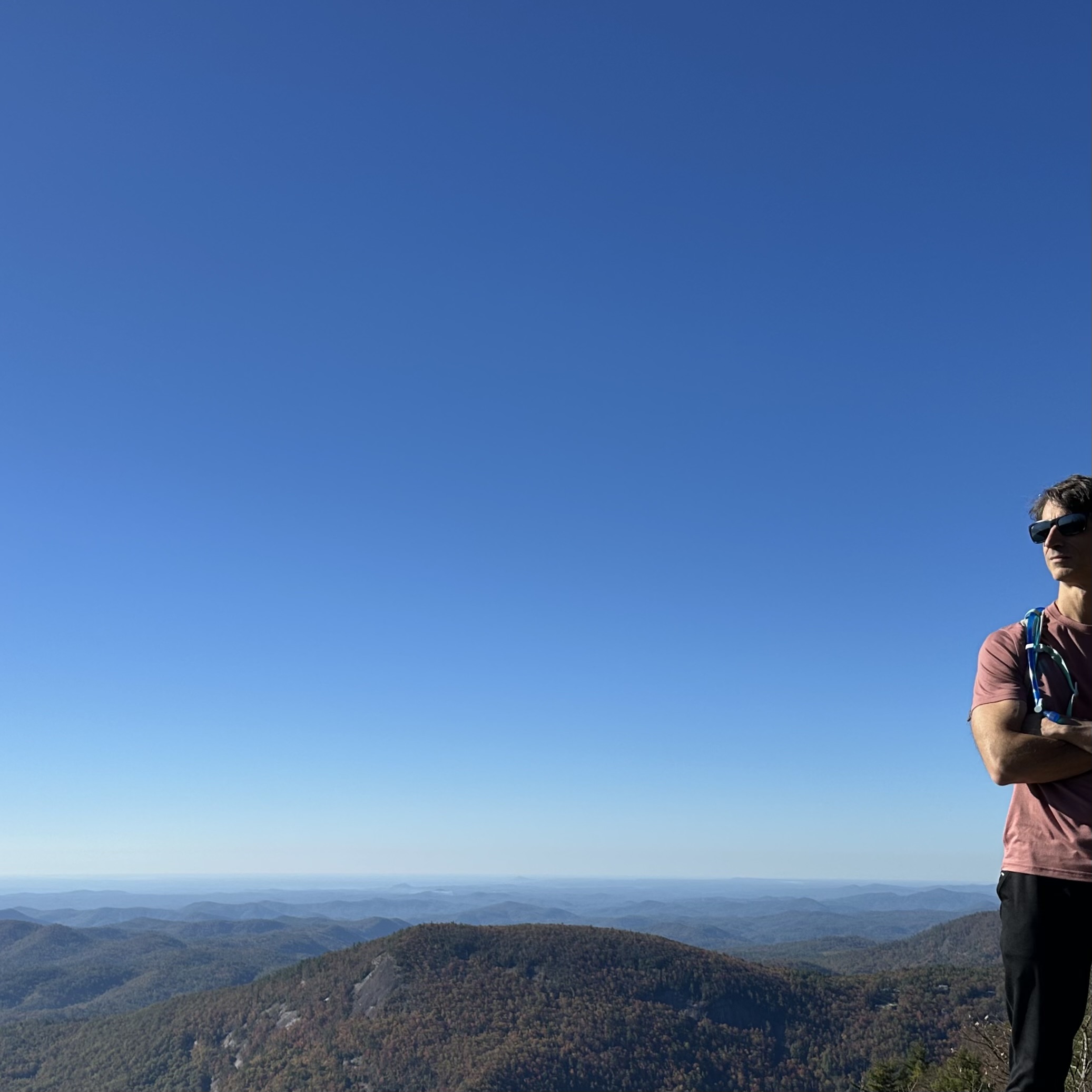 Damian Coccio hiking in the mountains