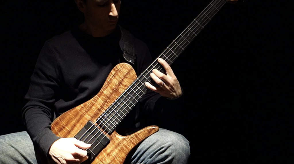 Damian Coccio playing solo bass guitar