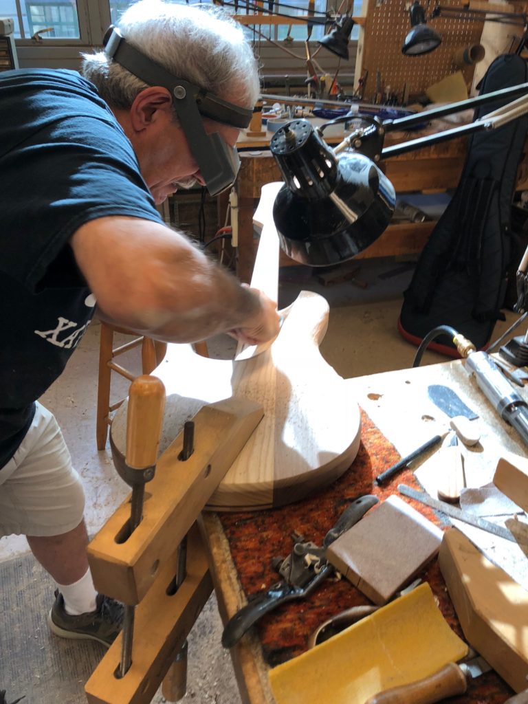 Vinny Fodera carving the bass body